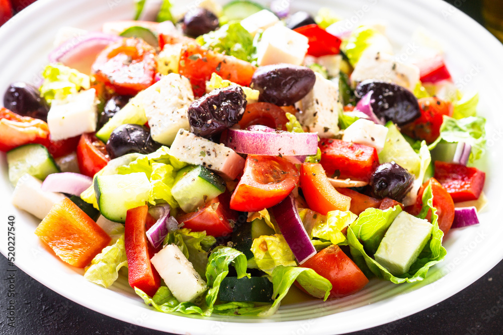 Greek salad. Vegetable salad with tomato, cucumber, feta cheese and olive oil with herbs.