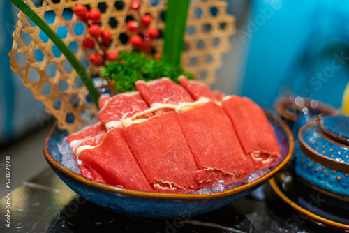 Raw beef slice for hot pot, fresh snowflake beef slices, chinese food. Selective focus.