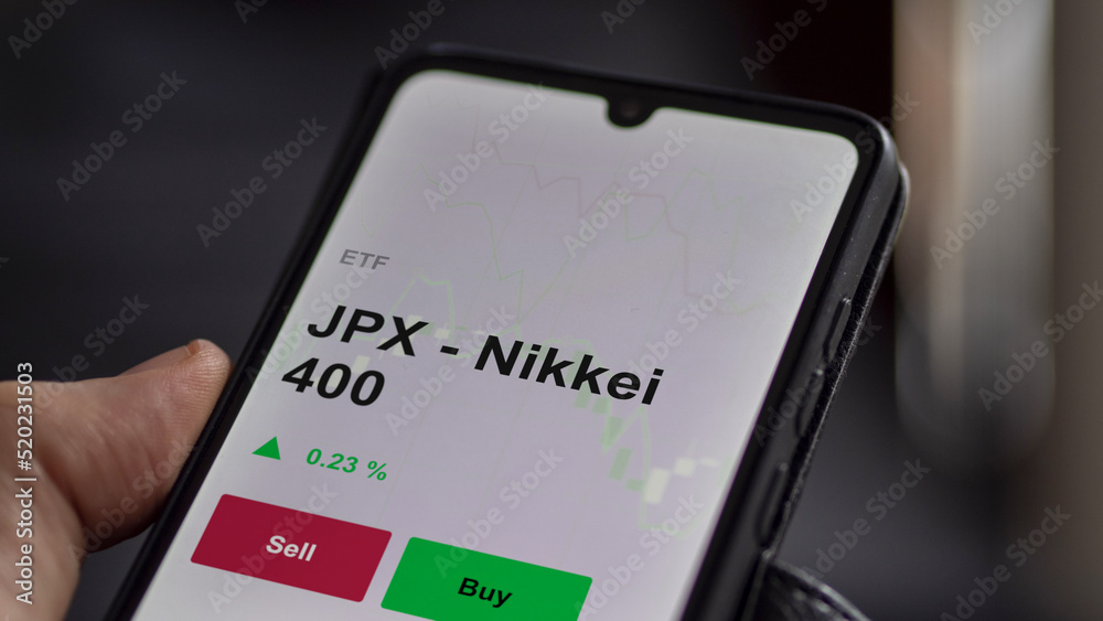 JPX - Nikkei 400 sur un graphique. Un téléphone affiche le cours de l'ETF JPX - Nikkei 400 JPX - Nikkei 400 sur un graphique. Un téléphone affiche le cours de l'ETF JPX - Nikkei 400