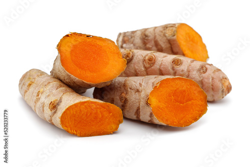 Fresh turmeric and slices isolated on white background