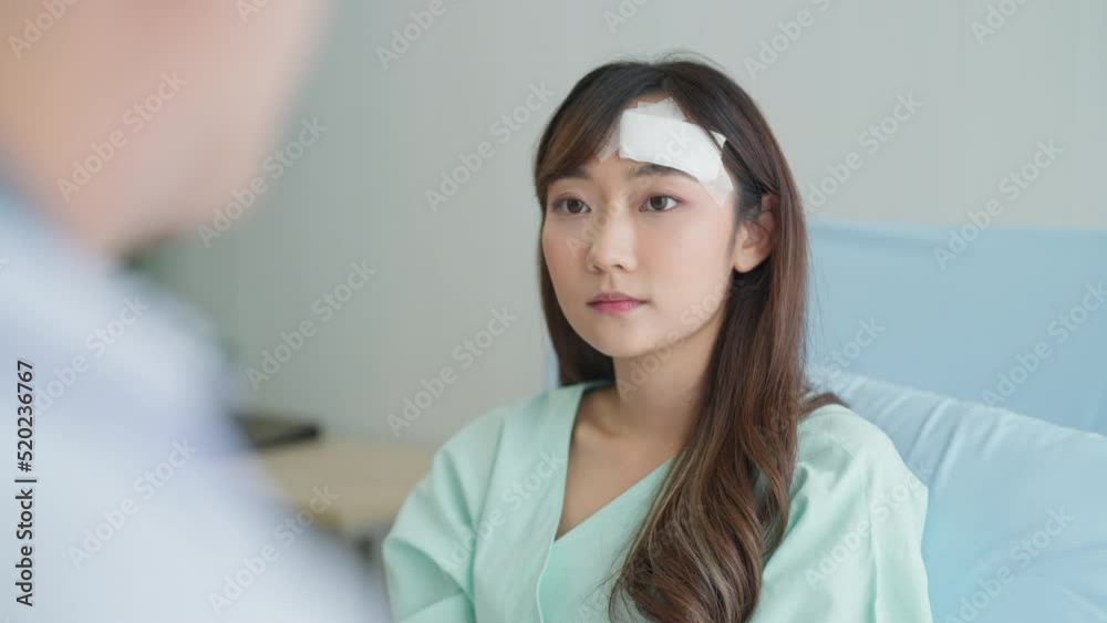 Doctor Talking with Female Patient at Hospital. Male Doctor Explained the Surgery to Her. Healthcare, Medical, Lifestyle, Patient, Insurance Concept. Doctor Talking with Female Patient at Hospital. Male Doctor Explained the Surgery to Her. Healthcare, Medical, Lifestyle, Patient, Insurance Concept.