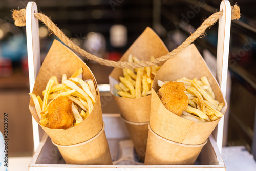 Fototapeta Naklejka Na Ścianę i Meble -  fast food on the street chips and chicken