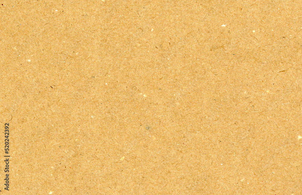 Highly detailed close up brown cardboard recycled uncoated smooth paper texture scan with dust and colorful particles with copyspace for text for high resolution wallpaper or mockup Highly detailed close up brown cardboard recycled uncoated smooth paper texture scan with dust and colorful particles with copyspace for text for high resolution wallpaper or mockup