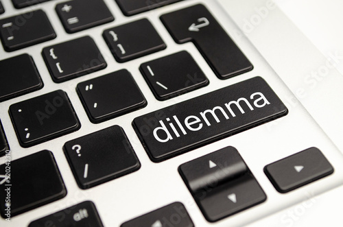 dilemma text button on keyboard, concept background photo