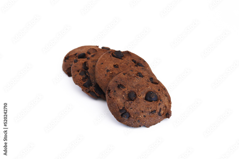 Dark cookies with chocolate chips on a white background. Shallow depth of field Dark cookies with chocolate chips on a white background. Shallow depth of field