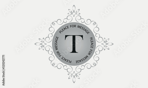A monogram with the letter T in an elegant frame. Place for text. Template for cafes, bars, boutiques, invitations, attractions. Logo for business. Vintage elements photo