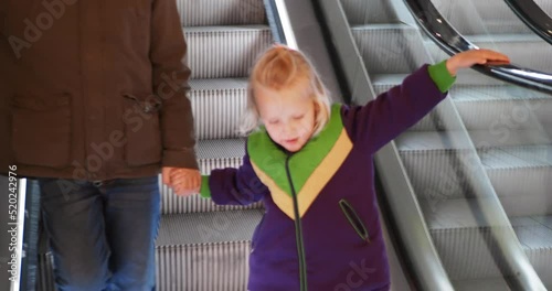 Brother and sister on the escalator