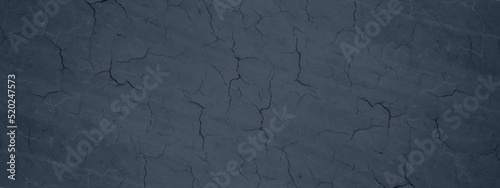 Abstract dark blue surface or painted wall texture, old and decorative blue grunge texture with cracks, blue background for wallpaper, cover, design and decoration.