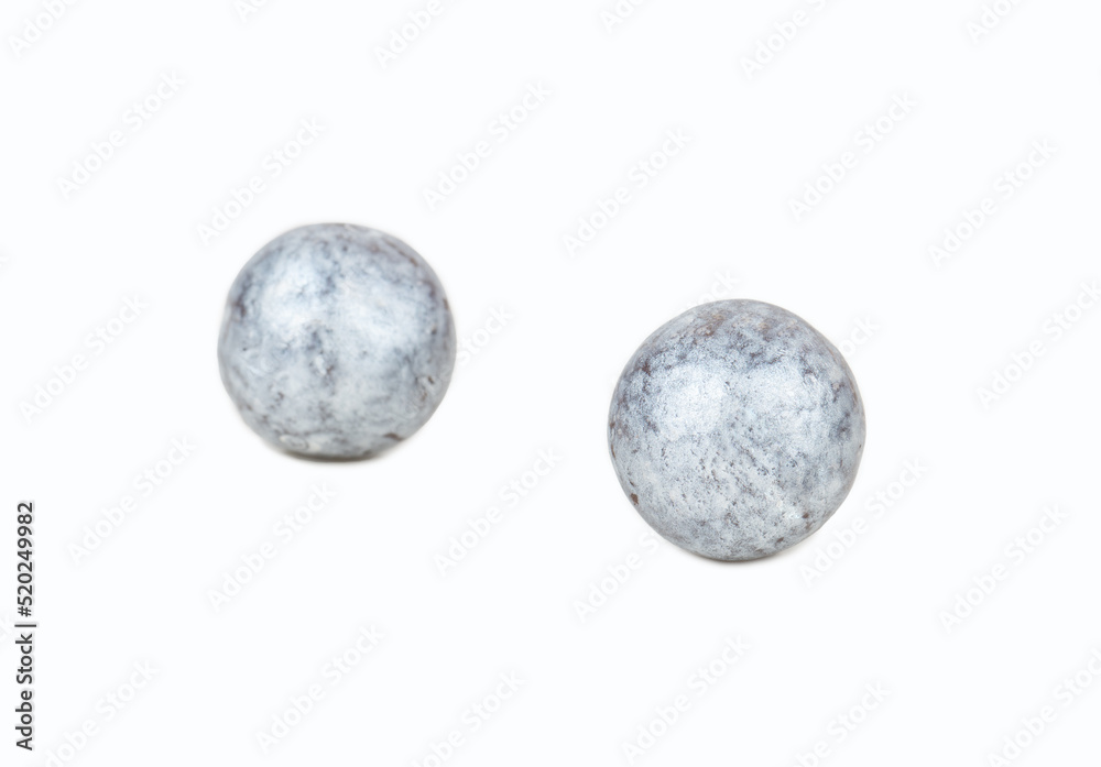Naklejka premium Two silver candies hazelnuts in chocolate isolated on white background
