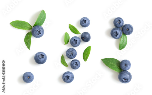 Set of blueberries isolated on white background. Blueberry berries with green leaves. Bilberry, huckleberry. Top view, flat lay.