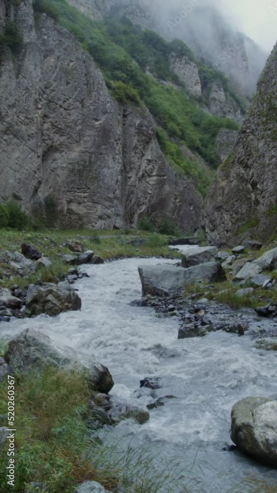 Mountain river, seething with strong stream among the rocks Mountain river, seething with strong stream among the rocks
