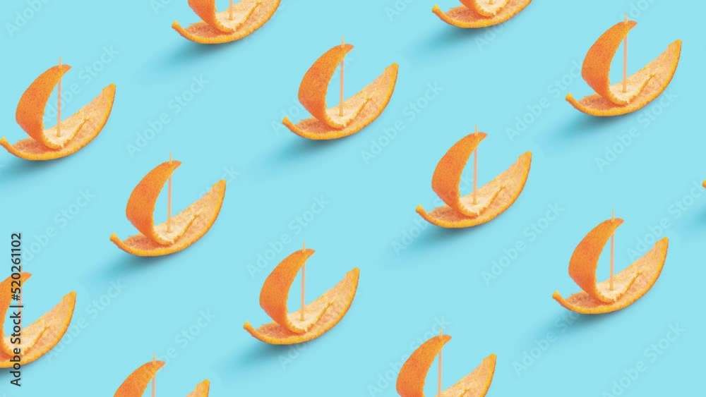 Summer concept with small boats made of orange peel on pastel blue background 4K. Summer concept with small boats made of orange peel on pastel blue background 4K.