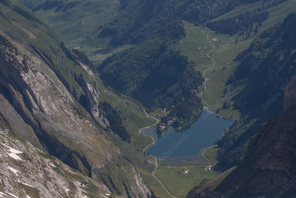 A summer view on the alpine lake in the valley A summer view on the alpine lake in the valley