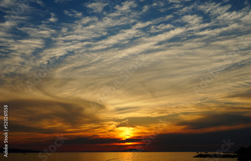 Dramatic intensive colors of sea sundown at summer evening © Happy window