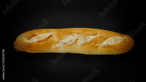 Fresh bread baguette loaf with seeds in a rustic style. Baking homemade healthy bread