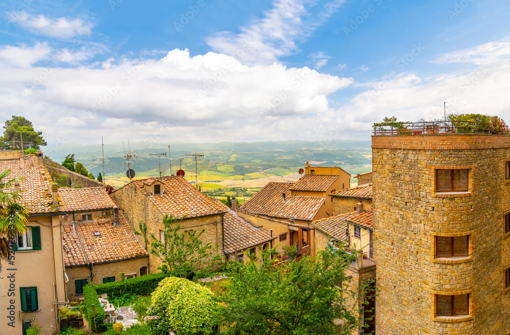 View of the hills and countryside from a terrace along the outer walls of the Tuscan hill town of Volterra, Italy.