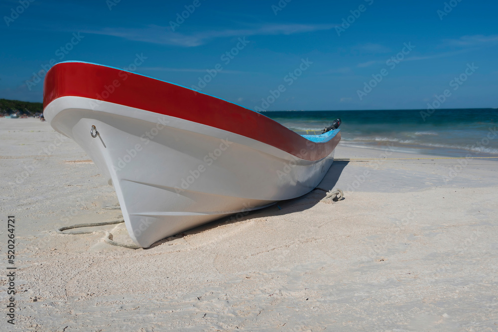 Colorful boat on the beach on sunny day, with copy space.