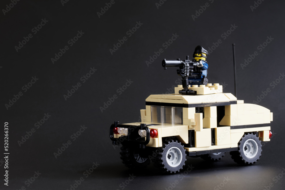 Swat military minifigures, similar to Lego. SUV with a soldier and a  machine gun on the roof. Barcelona. Spain. July 29, 2022. Stock Photo
