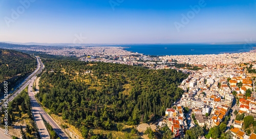 Drone aerial view of port city - Thessaloniki - showing cluttered white houses with orange rooftop. Sunny weather. Summer voyage concept. High quality photo © PoppyPix