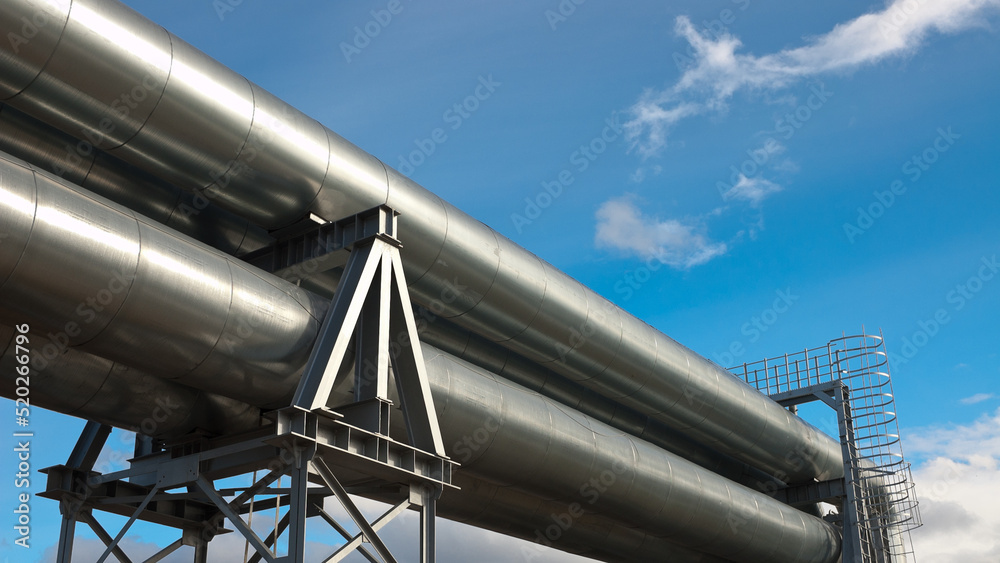 pipeline, in the photo pipeline close-up against a background of green forest and blue sky. pipeline, in the photo pipeline close-up against a background of green forest and blue sky.