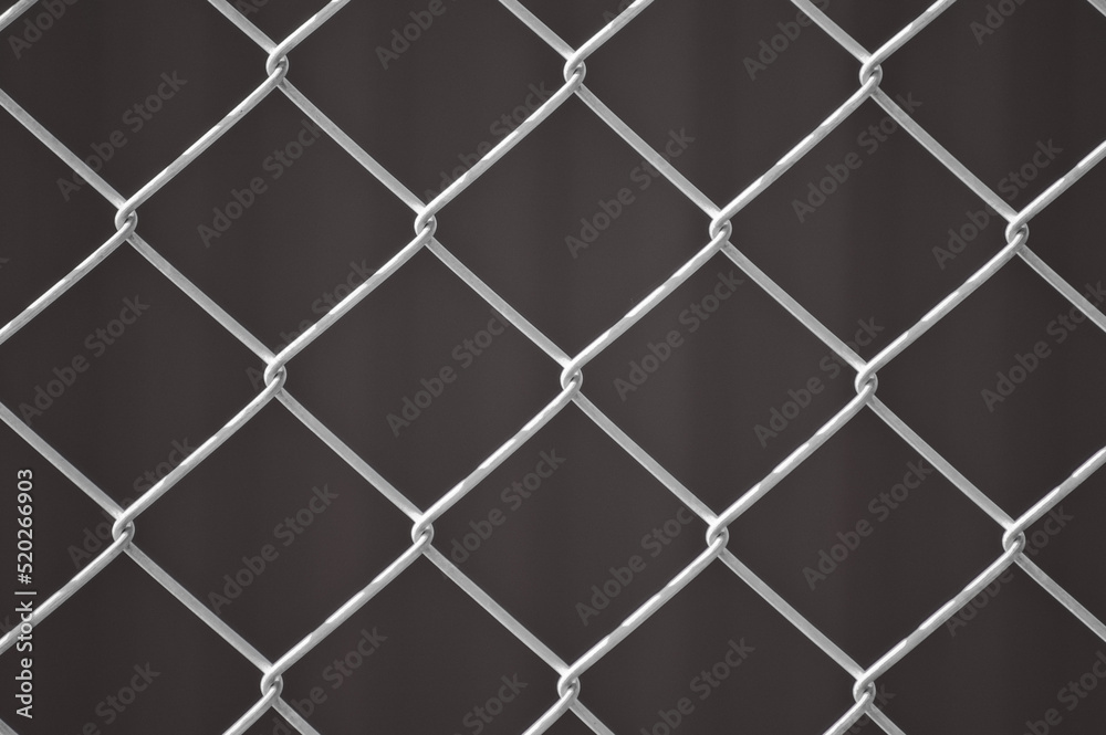 metal mesh,in the photo a mesh on a gray background metal mesh,in the photo a mesh on a gray background