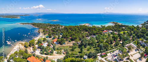 Fototapeta Naklejka Na Ścianę i Meble -  Drone aerial view of a small village next to the Karydi Beach. Summer holidays destination. Halkidiki Peninsula in Greece. High quality photo