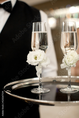 Two wedding champagne glasses on a tray