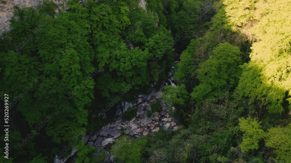 touristic landmark in Georgia - beautiful Okatse Canyon and its small cascade, birds-eye view. High quality 4k footage touristic landmark in Georgia - beautiful Okatse Canyon and its small cascade, birds-eye view. High quality 4k footage