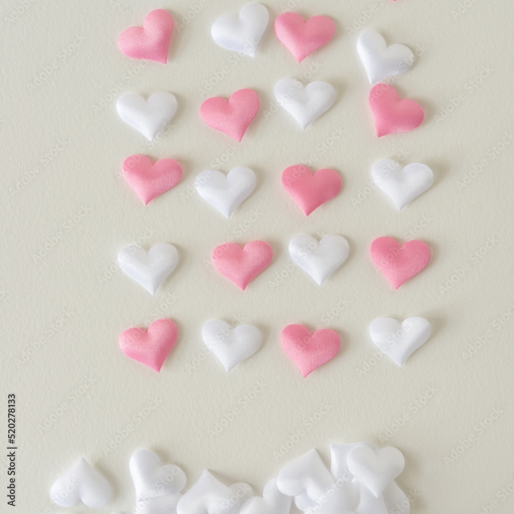 set of fabric pillow hearts on blank paper