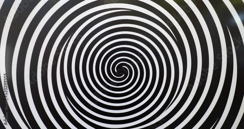 Moving hypnotic spiral, optical illusion photo