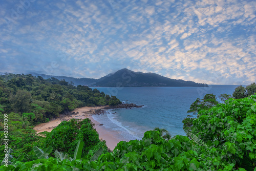 Colourful Skies Sunset over Head Laem Sing Beach in Phuket Thailand. This Lovely island waters are turquoise blue waters, lush green mountains colourful skies and beautiful views of Pa Tong Patong