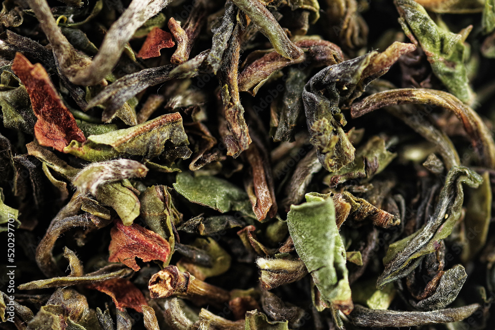 Premium green loose leaf tea as a background. Texture of dry green tea leaves. Extreme macro mode
Premium green loose leaf tea as a background. Texture of dry green tea leaves. Extreme macro mode