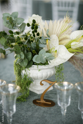 Bouquet of flowers in vase on the wedding table