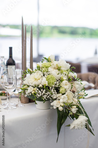 Bouquet of flowers in vase on the wedding table