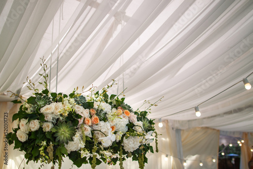 Bouquet of flowers in vase on the wedding table