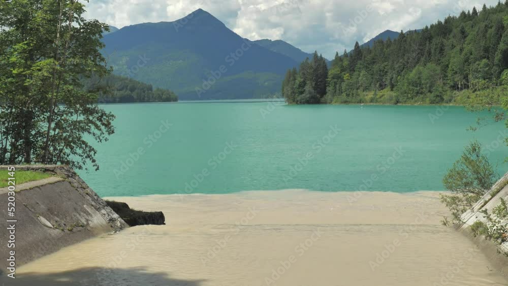 Muddy water with calcareous deposits flows from the mountain tops into