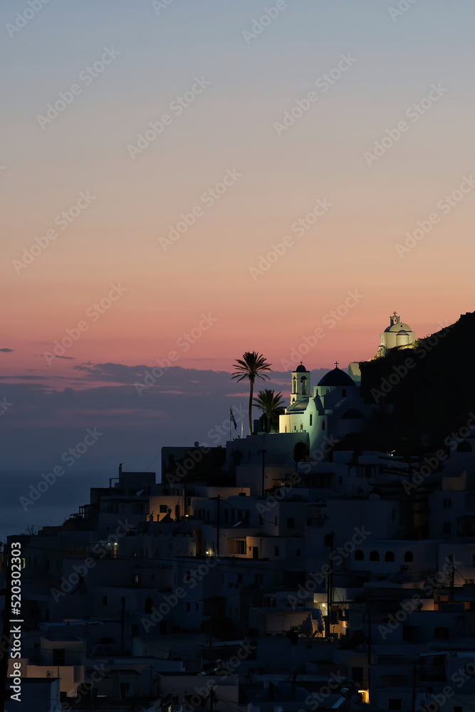 Beautiful sunset and view of the picturesque and whitewashed island of Ios Greece