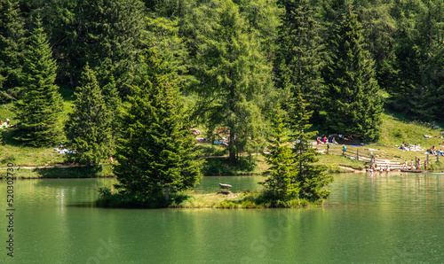 Lake Tret is among the most beautiful forest lakes of South Tyrol, Italy - the lake is surrounded by larch forests and pastures at an altitude of 1,600 m.s.l