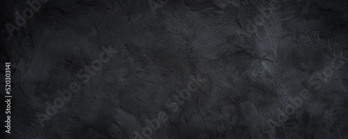 Black or dark gray rough grainy stone texture background