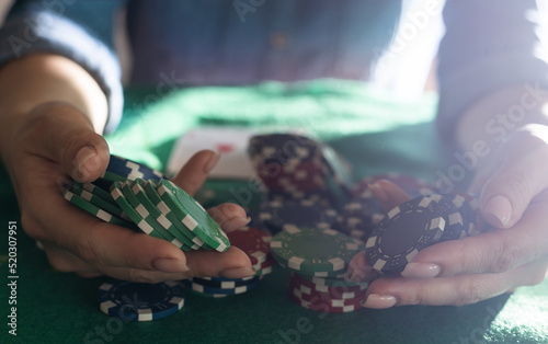 woman hands holding playing cards with poker straight combination.