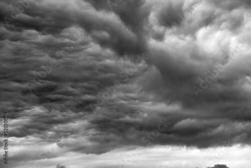 Swirling evening clouds illuminated by the setting sun