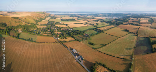 Glorious aerial drone panoramic landscape image of South Downs in English countryside on Summer morning photo