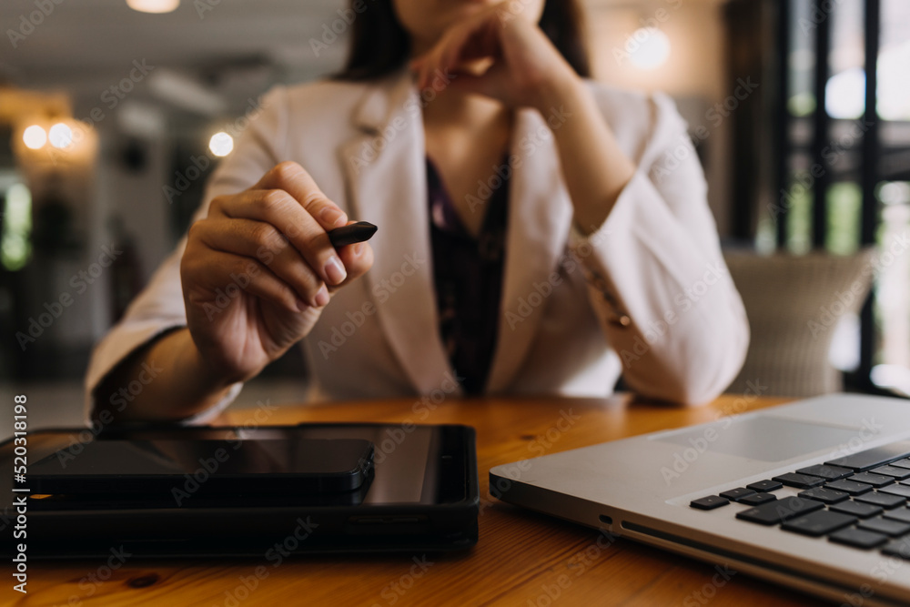 Businessman and team analyzing financial statement Finance task. with smart phone and laptop and tablet. Wealth management concept Businessman and team analyzing financial statement Finance task. with smart phone and laptop and tablet. Wealth management concept