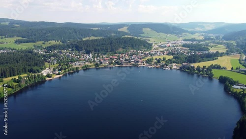 Aerial drone footage of flight over the scenic Lake Titisee in the Black Forest in Southern Germany at sunset