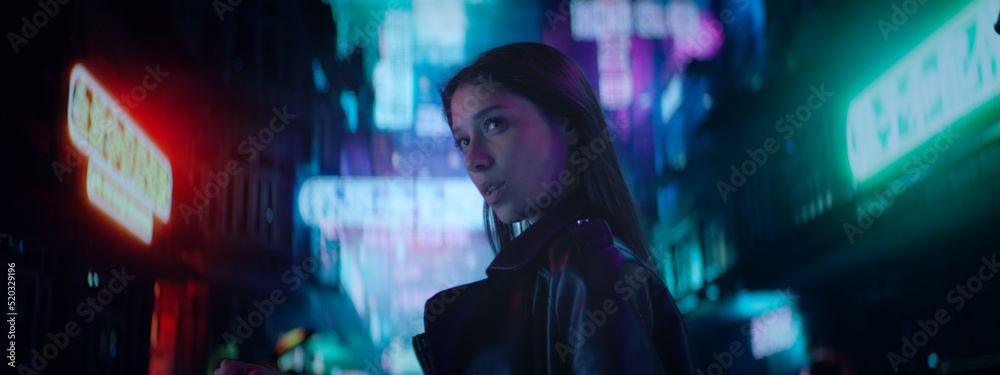 CU Night portrait of Hispanic standing in the streets filled with neon lights. Hong Kong style background