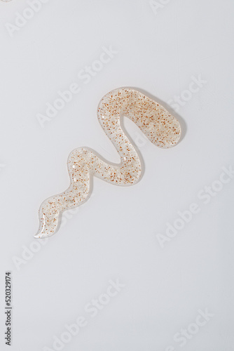 Smear of salt or sugar scrab on white background. Texture pink cosmetic scrub for face and body - Image