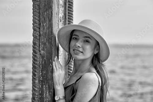 Obraz na płótnie Portrait of a young beautiful girl in a hat. Black and white image w salonie