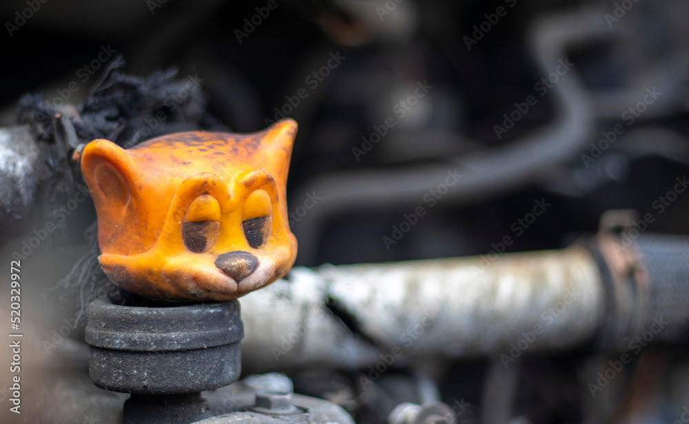 Broken car after a traffic accident. Auto insurance concept. Broken and damaged car. A toy in a burned-out car among spare parts and pipes. Broken car after a traffic accident. Auto insurance concept. Broken and damaged car. A toy in a burned-out car among spare parts and pipes.