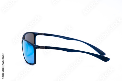 Fashion sunglasses black frames and blue lens on white background. photo