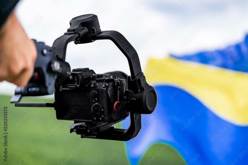 Video camera man operator working with professional equipment, filming, recording. Cameraman shooting video Video camera man operator working with professional equipment, filming, recording. Cameraman shooting video